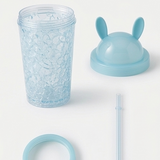 Collage of a blue ice cube tray with rabbit ears, ice cubes, and a person holding it outdoors.